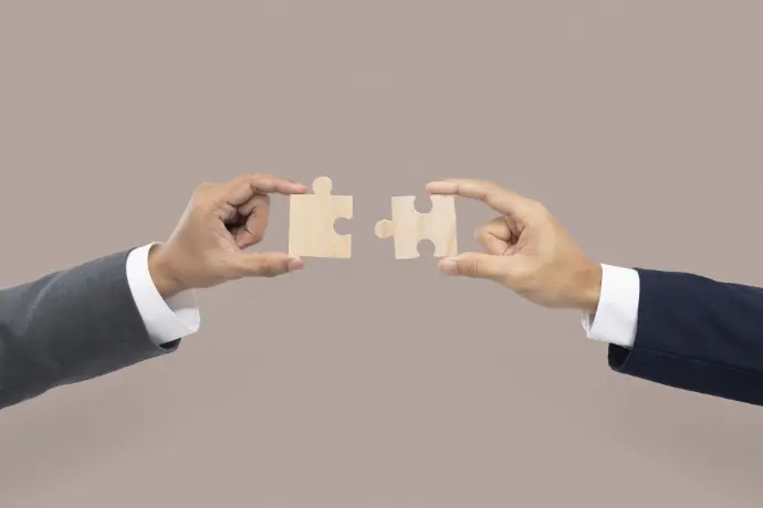 two puzzles connecting together symbolized partnership